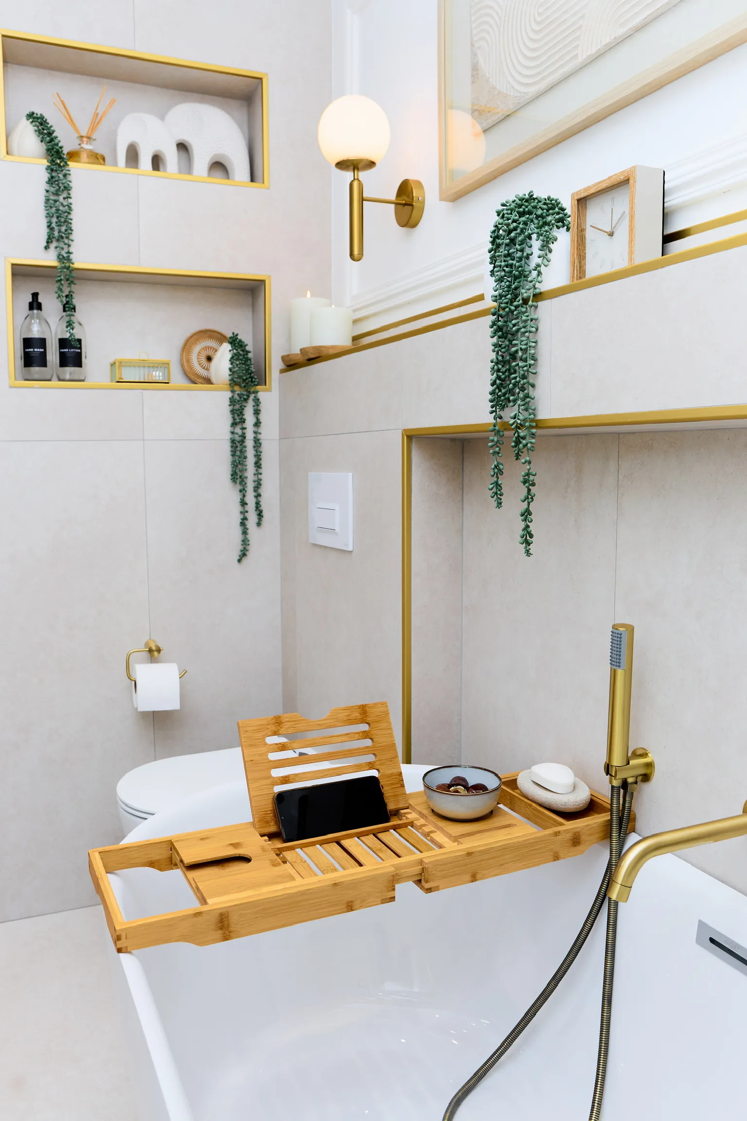 The Golden Bathroom — freestanding bath with gold fixtures